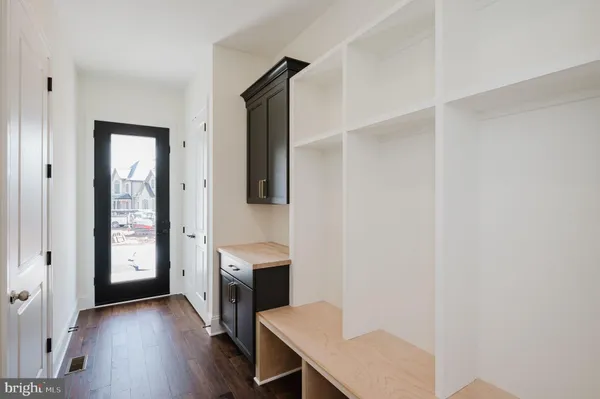 an empty room with a ceiling fan and a window