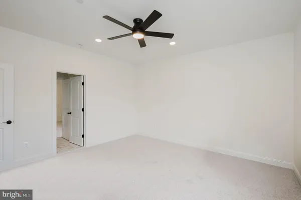 an aerial view of a residential houses with outdoor space and street view