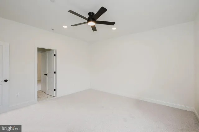 an aerial view of a residential houses with outdoor space and street view