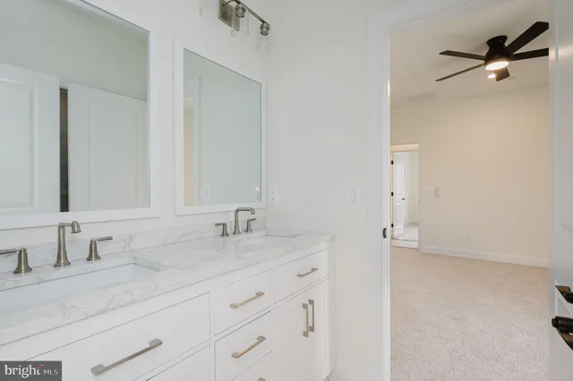a view of a swimming pool with a yard and plants
