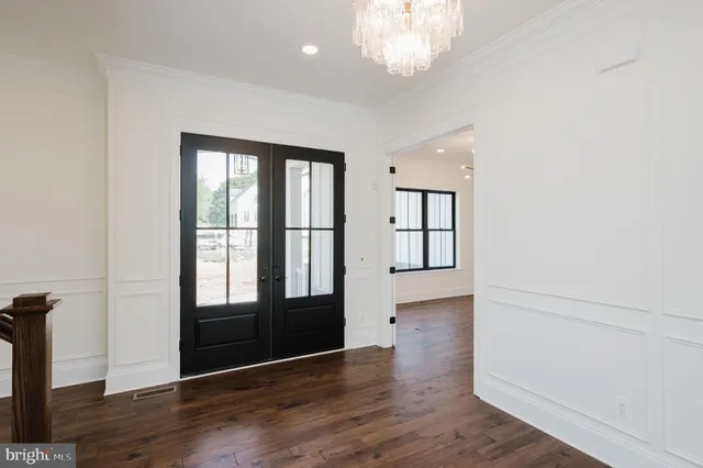 a view of entryway with stairs and wooden floor