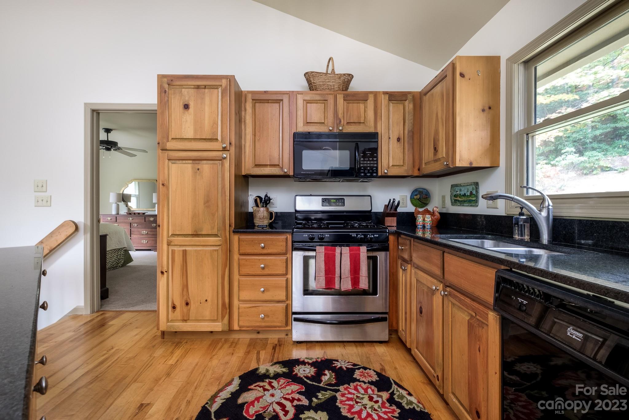 122 Columbine Way Cleveland, SC 29635 - Photo 12 of 28 a kitchen with stainless steel appliances a stove refrigerator sink and microwave