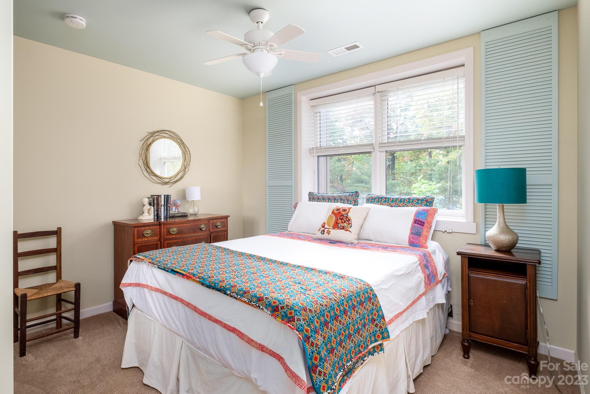 122 Columbine Way Cleveland, SC 29635 - Photo 15 of 28 a bedroom with a bed and a chandelier