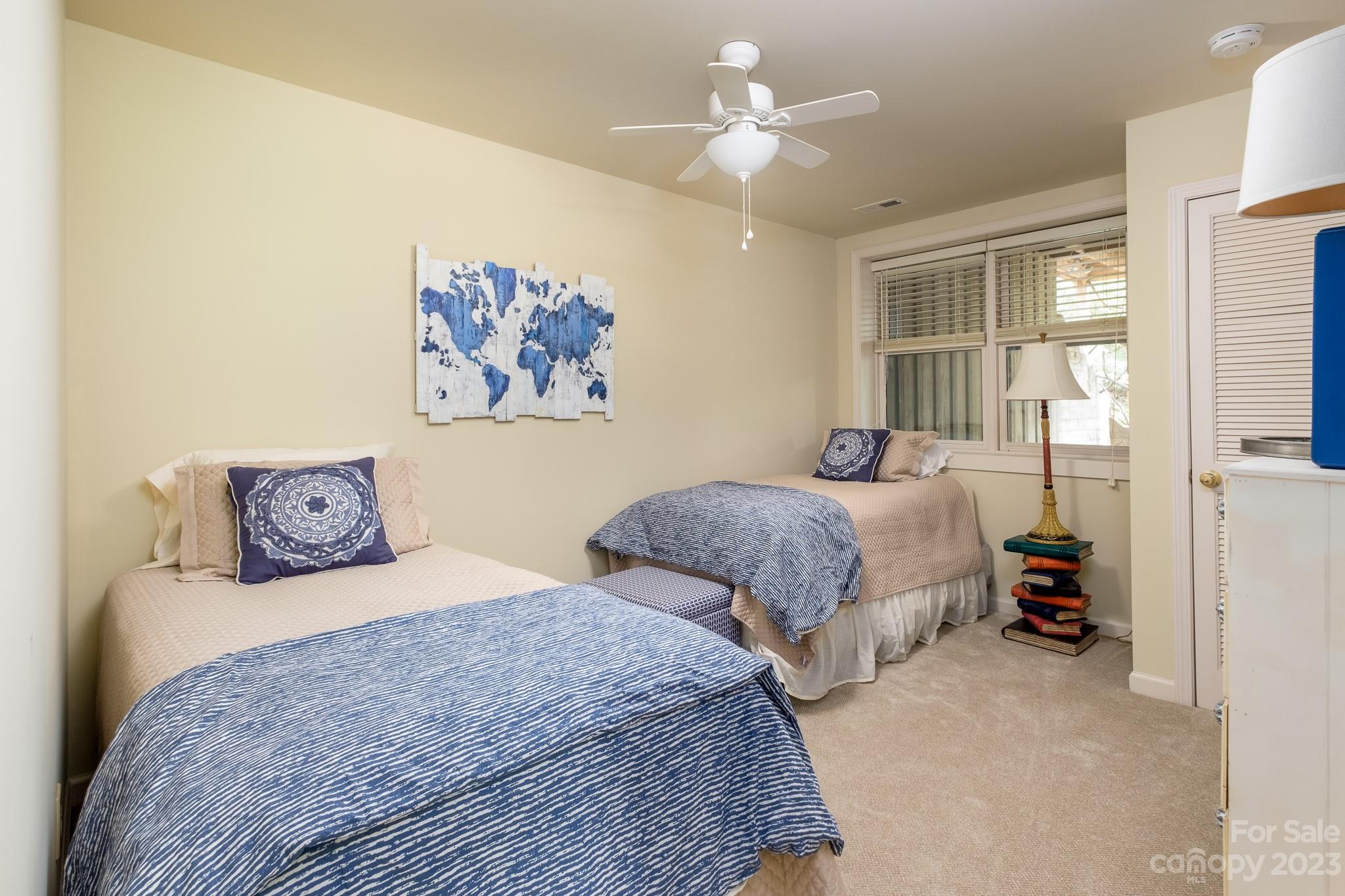 122 Columbine Way Cleveland, SC 29635 - Photo 16 of 28 a bedroom with two beds and a chandelier