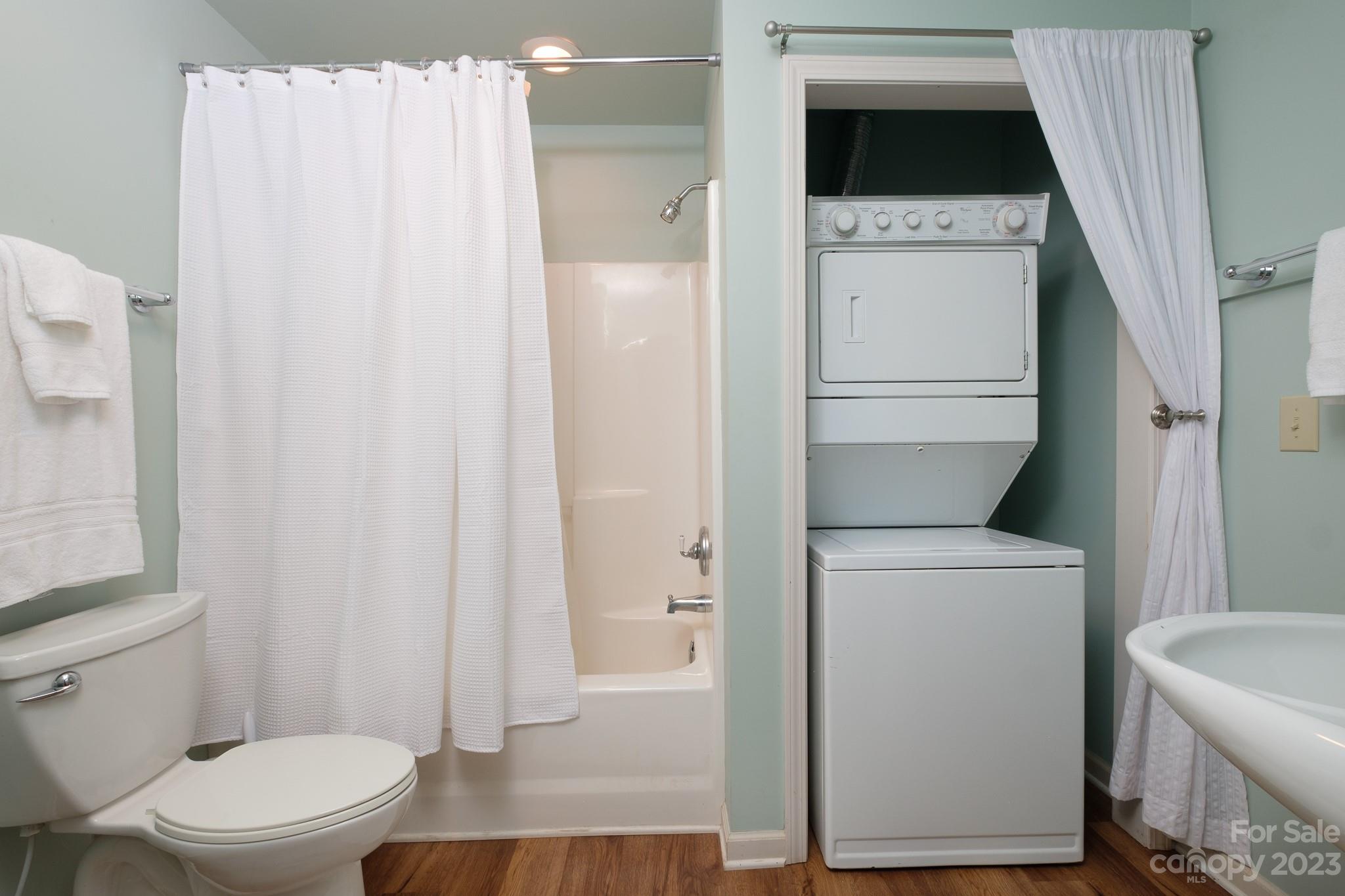 122 Columbine Way Cleveland, SC 29635 - Photo 17 of 28 a white toilet sitting next to a bathroom sink