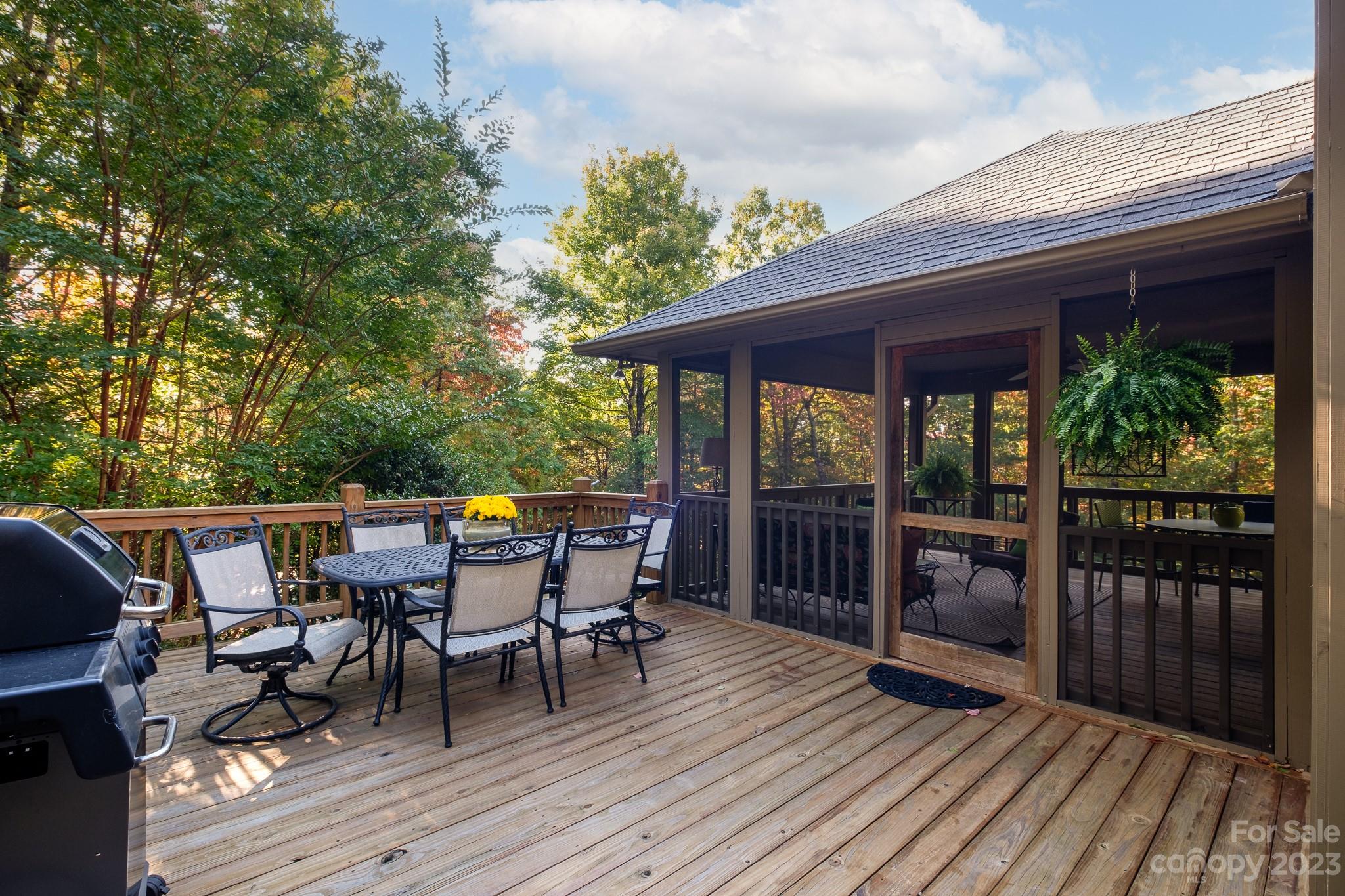 122 Columbine Way Cleveland, SC 29635 - Photo 4 of 28 a roof deck with a dining table and chairs with wooden floor