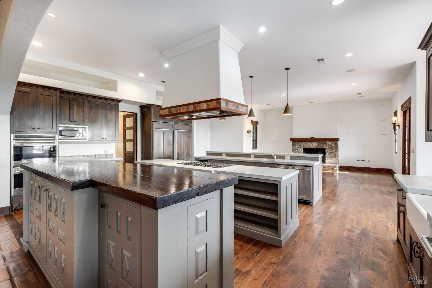 969 Rachael Road Sonoma, CA 95476 - Photo 10 of 81 a kitchen with stainless steel appliances granite countertop a sink a stove and a wooden floors