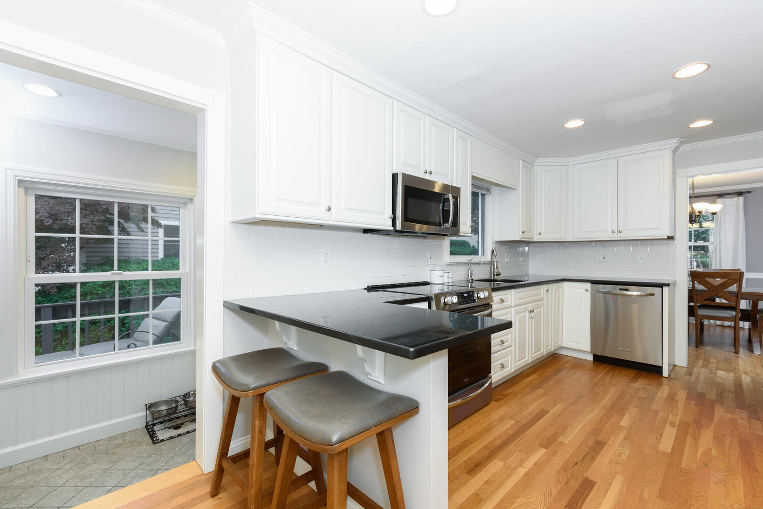 18 Patton Drive Darien, CT 06820 - Photo 11 of 35 a kitchen with a stove a sink and a microwave
