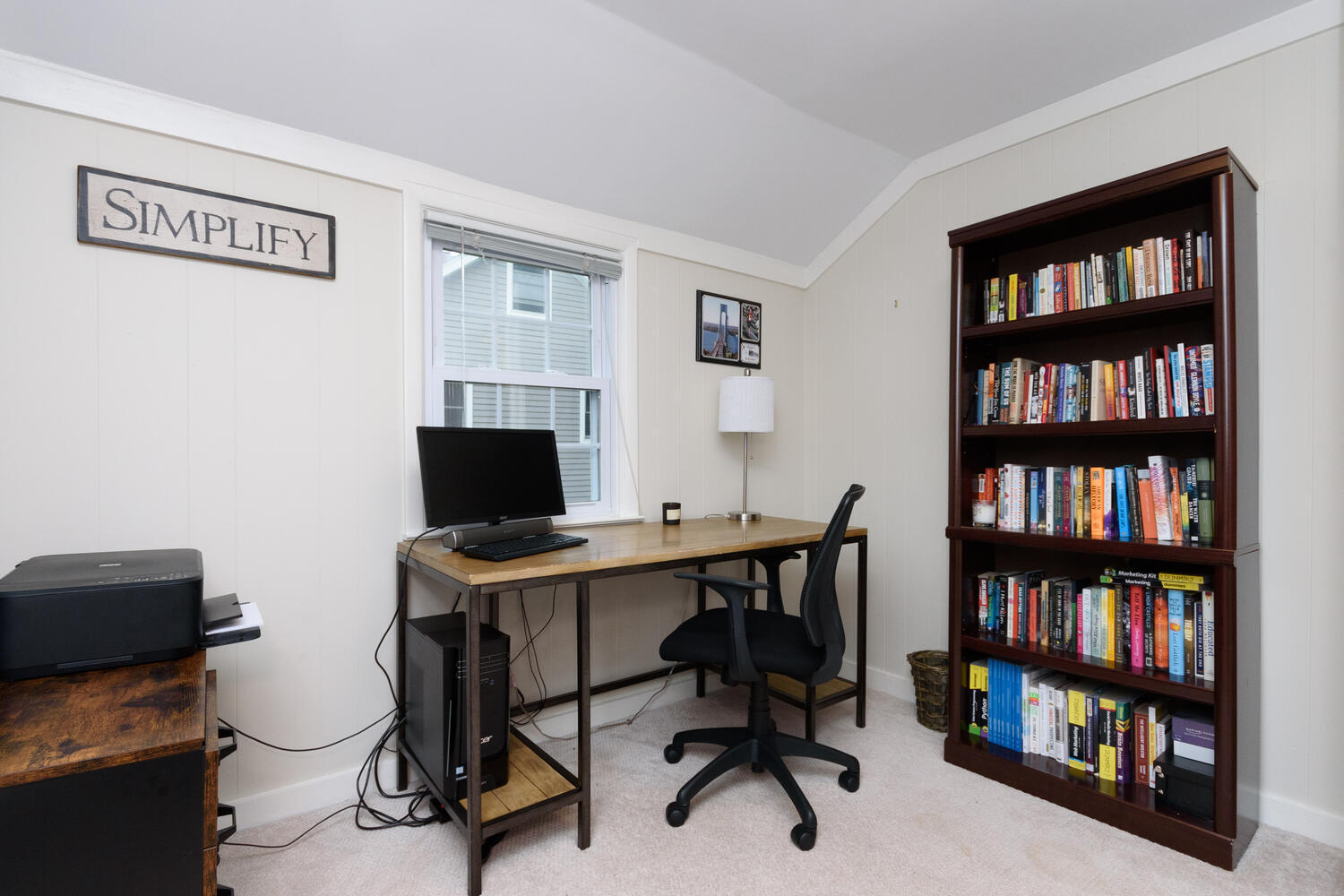 18 Patton Drive Darien, CT 06820 - Photo 22 of 35 a view of a workspace with a bookshelf