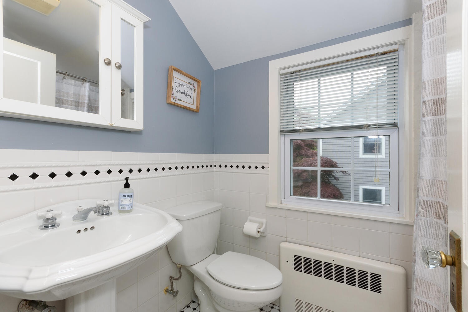 18 Patton Drive Darien, CT 06820 - Photo 24 of 35 a bathroom with a sink a toilet and a window