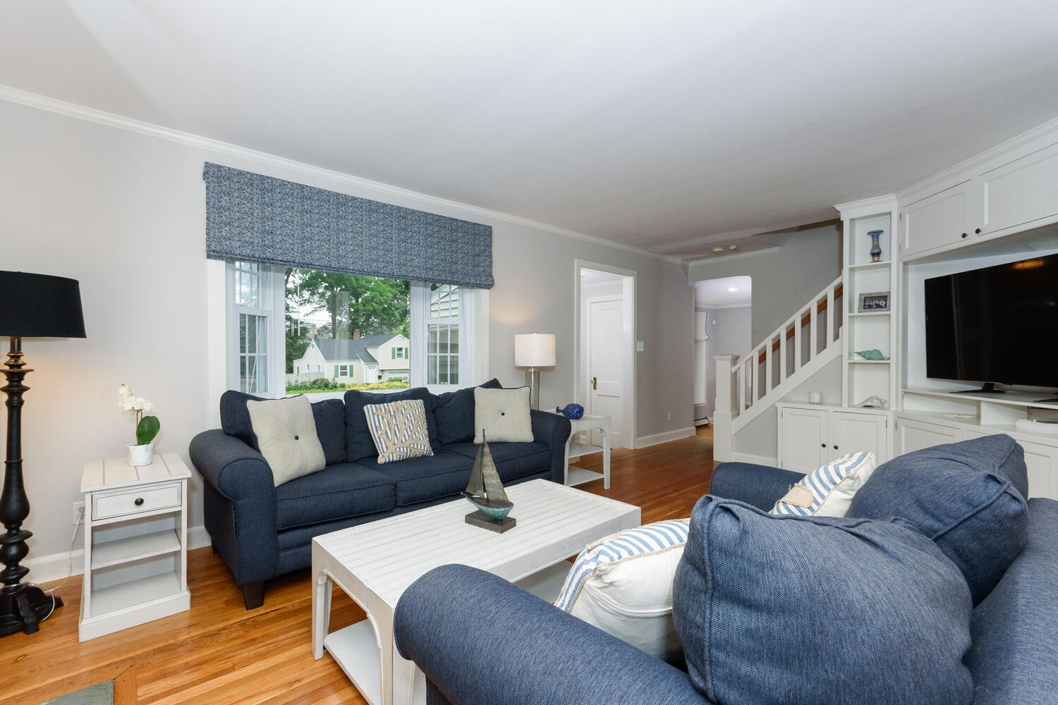 18 Patton Drive Darien, CT 06820 - Photo 4 of 35 a living room with furniture and a flat screen tv