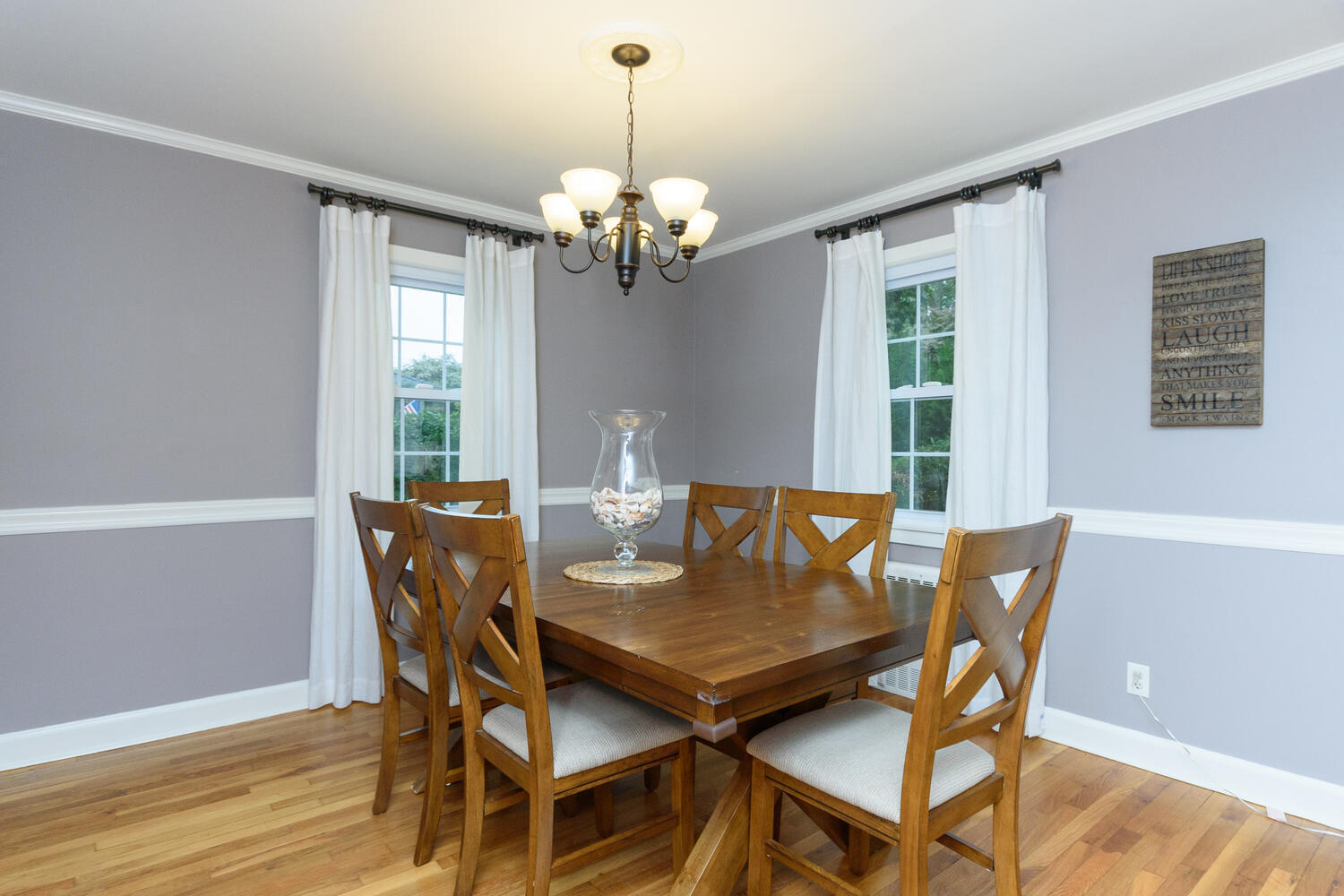 18 Patton Drive Darien, CT 06820 - Photo 8 of 35 a view of a dining room with furniture a chandelier and wooden floor