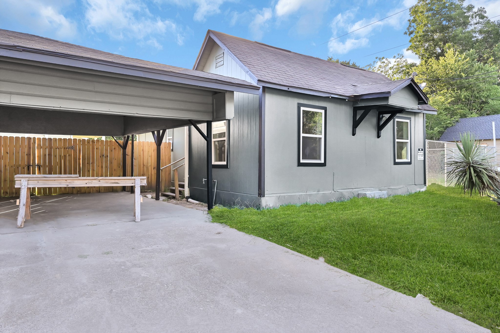 a view of a house with a backyard