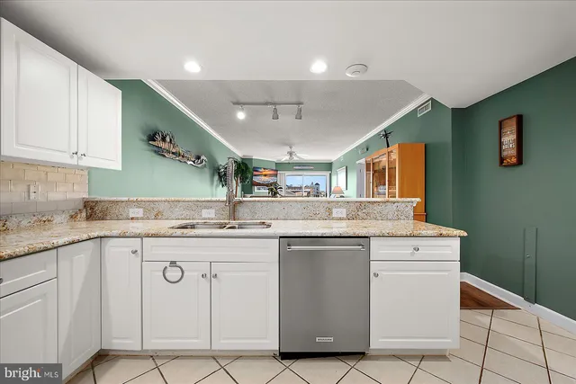 a bedroom with a bed and painting on the wall