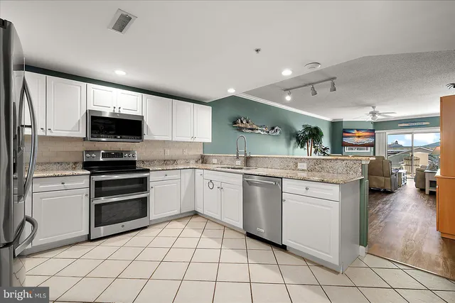 a bedroom with a bed and ceiling fan