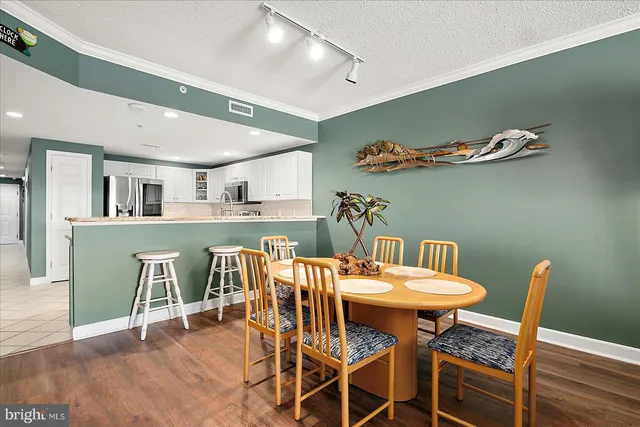 a spacious bathroom with a double vanity sink mirror and bathtub