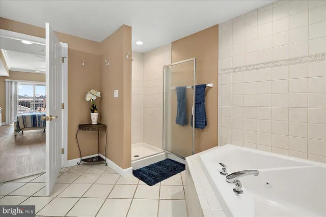 a bedroom with a baby bed a desk and chair