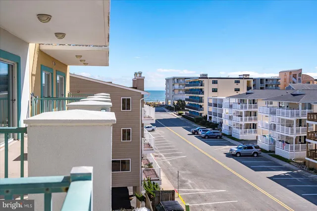 a view of a living room and a balcony
