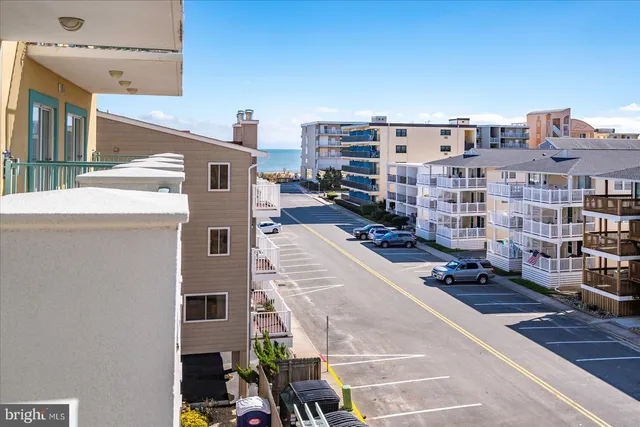 a view of swimming pool with seating space