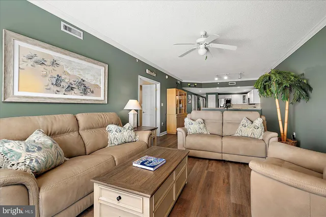 a kitchen with stainless steel appliances a sink and a refrigerator