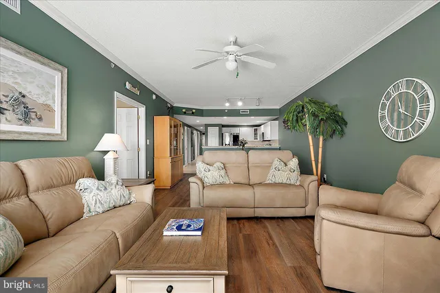 a kitchen with granite countertop white cabinets and stainless steel appliances