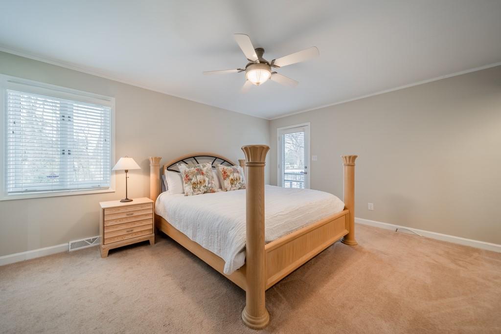 5111 Rounding Run Road Charlotte, NC 28277 - Photo 17 of 35 a bed sitting in a bedroom next to a window