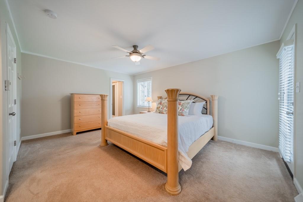 5111 Rounding Run Road Charlotte, NC 28277 - Photo 18 of 35 a bed room with a bed and a ceiling fan