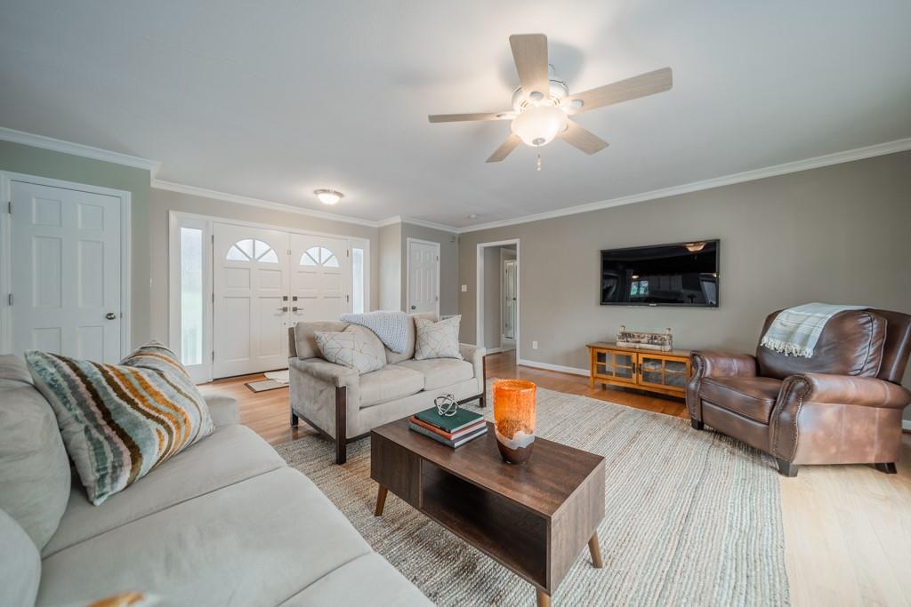 5111 Rounding Run Road Charlotte, NC 28277 - Photo 5 of 35 a living room with furniture and a flat screen tv