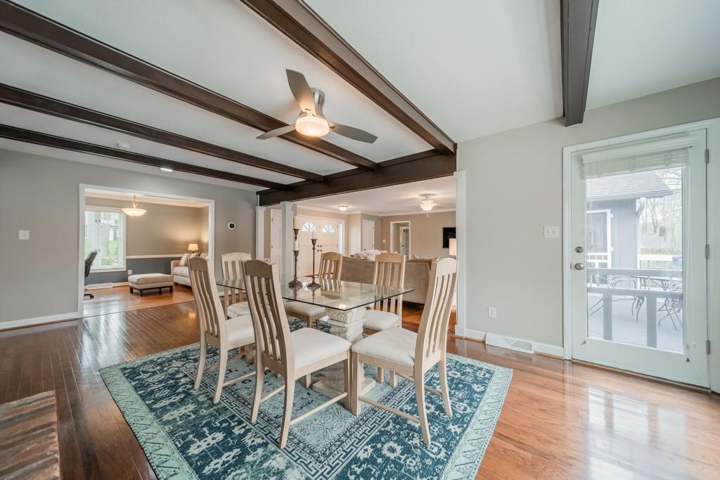 5111 Rounding Run Road Charlotte, NC 28277 - Photo 8 of 35 a dining room with furniture and wooden floor