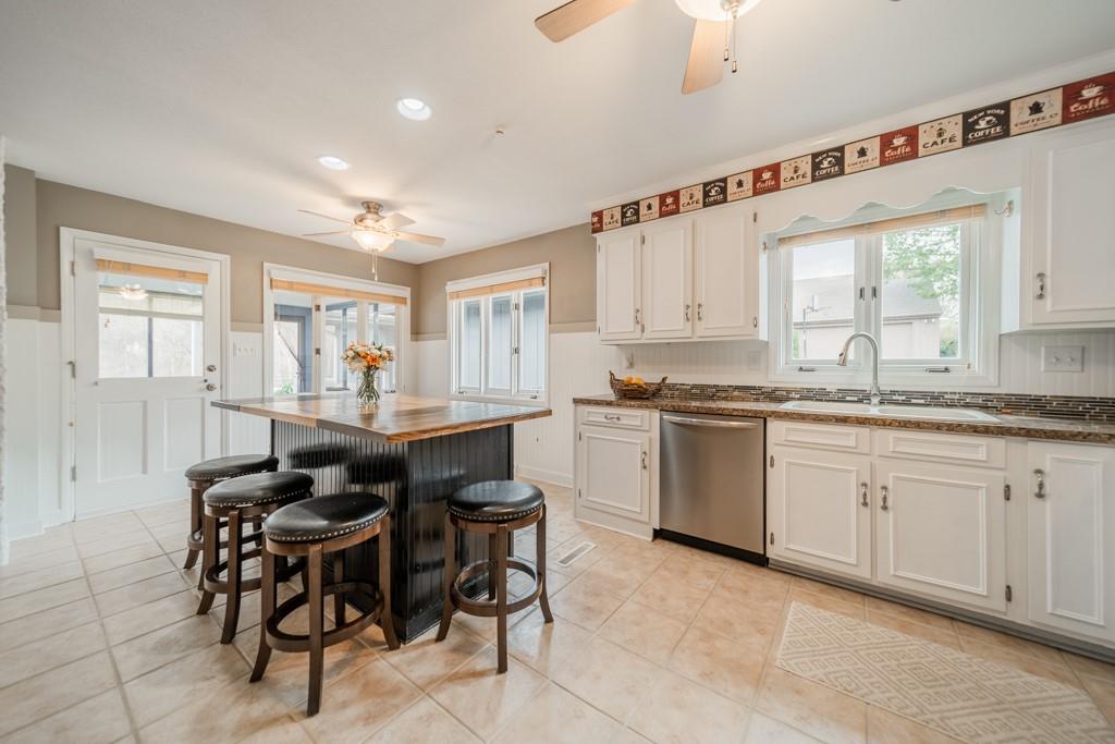 5111 Rounding Run Road Charlotte, NC 28277 - Photo 10 of 35 a kitchen with granite countertop cabinets table and chairs
