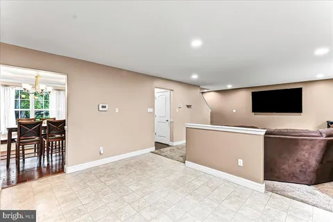 a view of a livingroom with furniture and flat screen tv