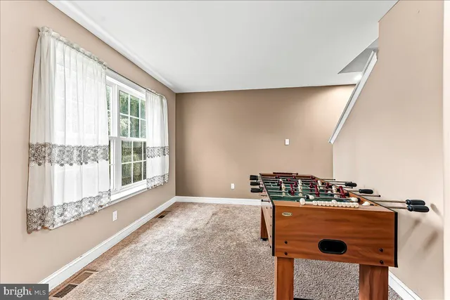 a view of kitchen with furniture and window