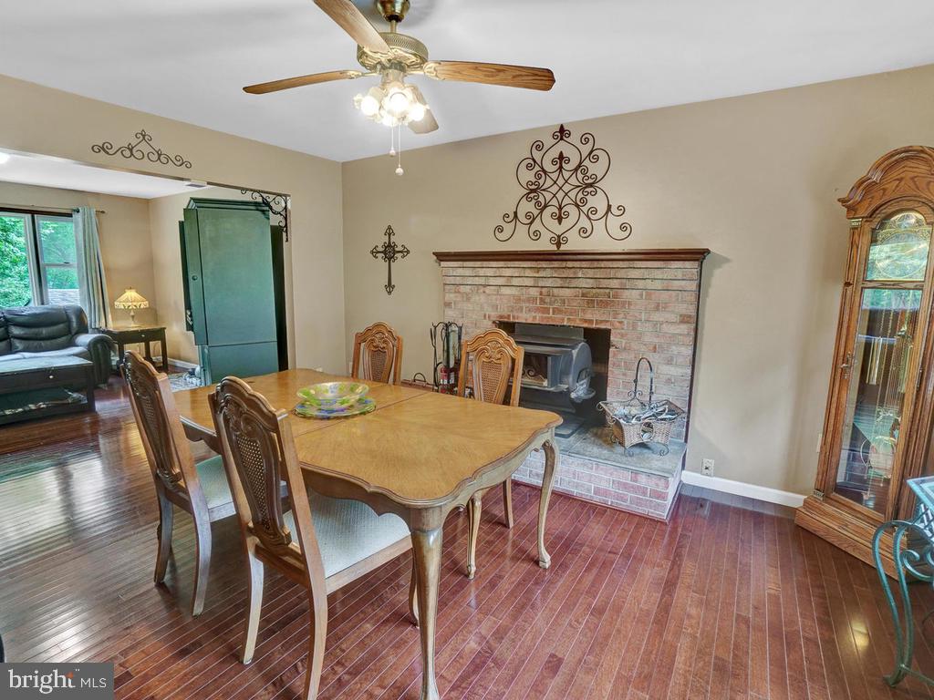 3608 Kemptown Church Road Monrovia, MD 21770 - Photo 13 of 58 Dining room with fireplace and wood stove