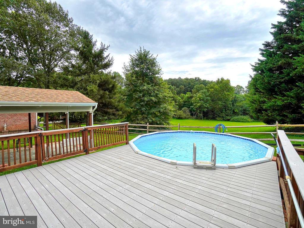 Pool with relaxing deck with lovely view