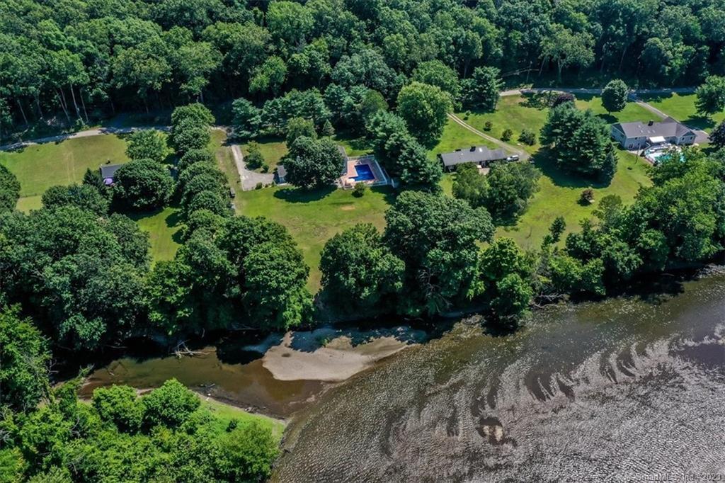517 River Road New Milford, CT 06755 - Photo 1 of 1 a view of a garden with a fountain