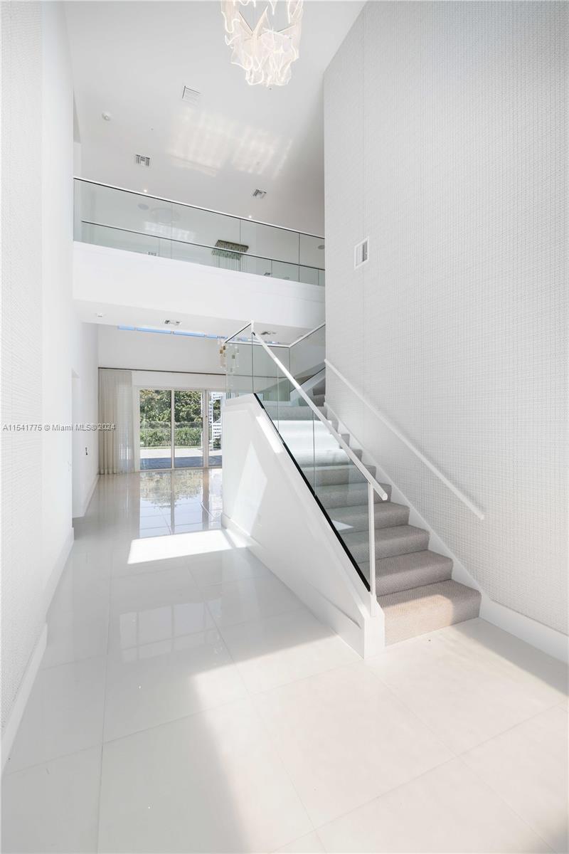 7153 Valencia Drive Boca Raton, FL 33433 - Photo 22 of 80 a view of entryway and hall with wooden floor