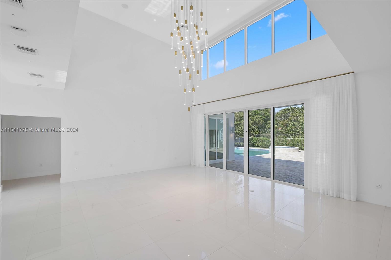 7153 Valencia Drive Boca Raton, FL 33433 - Photo 25 of 80 an empty room with windows