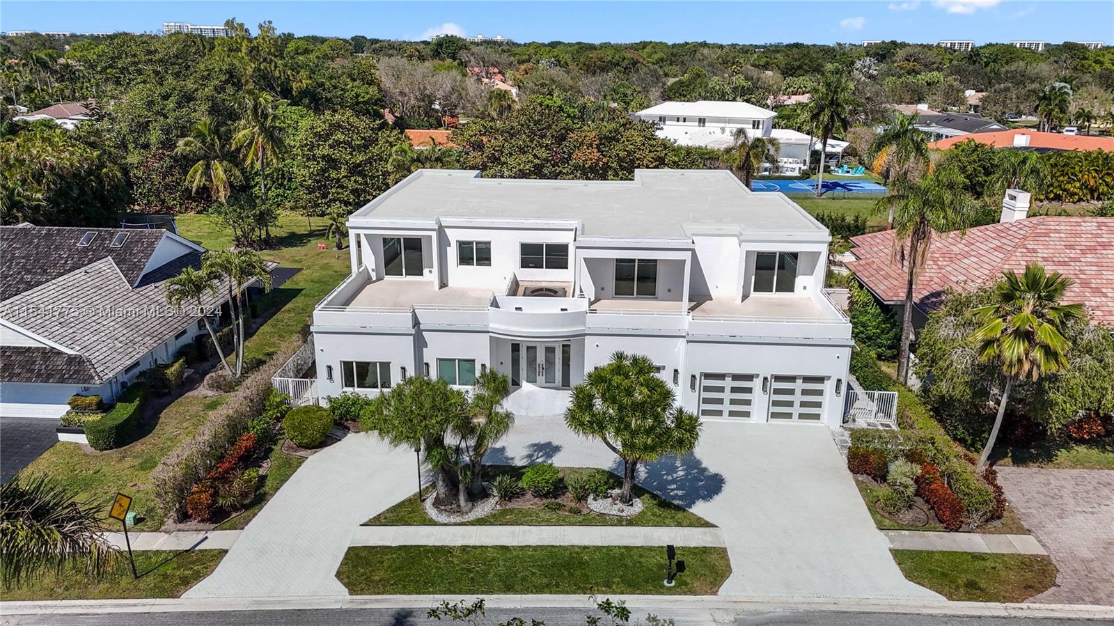 7153 Valencia Drive Boca Raton, FL 33433 - Photo 3 of 80 a front view of a house with a yard