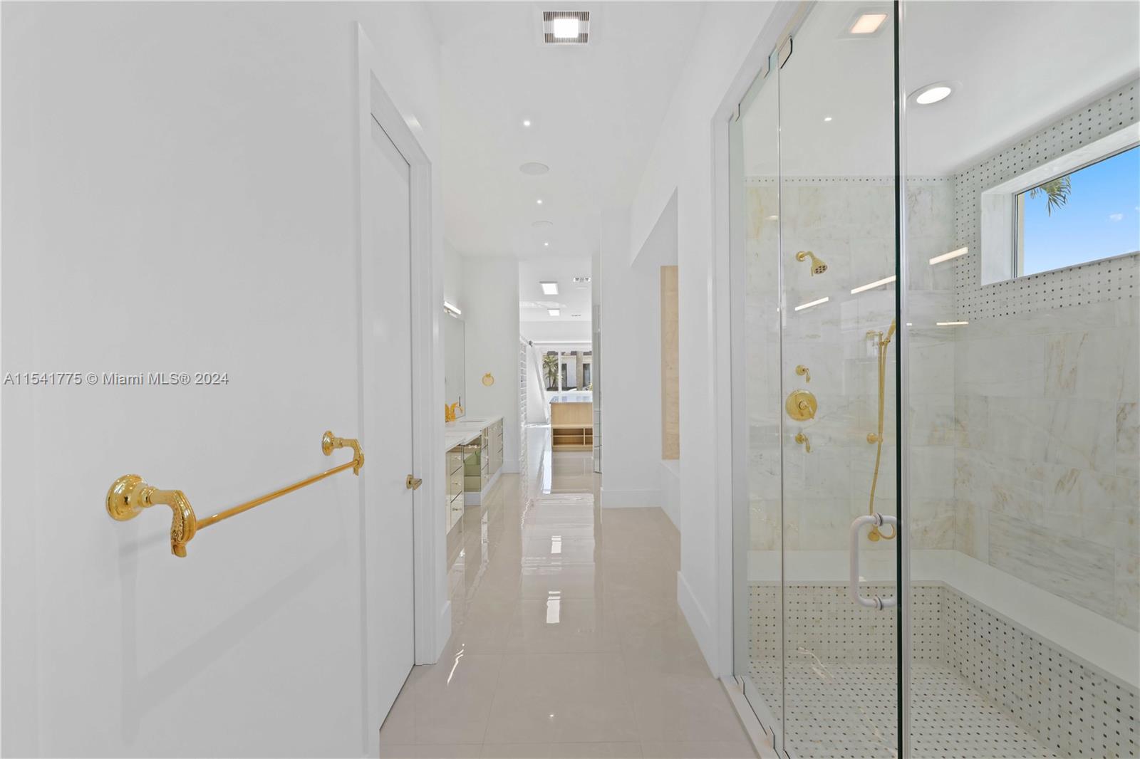 7153 Valencia Drive Boca Raton, FL 33433 - Photo 36 of 80 a bathroom with a shower and a glass door