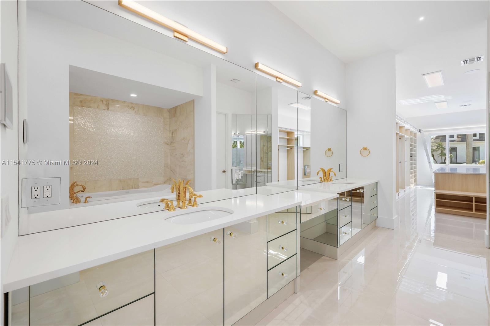 7153 Valencia Drive Boca Raton, FL 33433 - Photo 39 of 80 a bathroom with a sink and a mirror