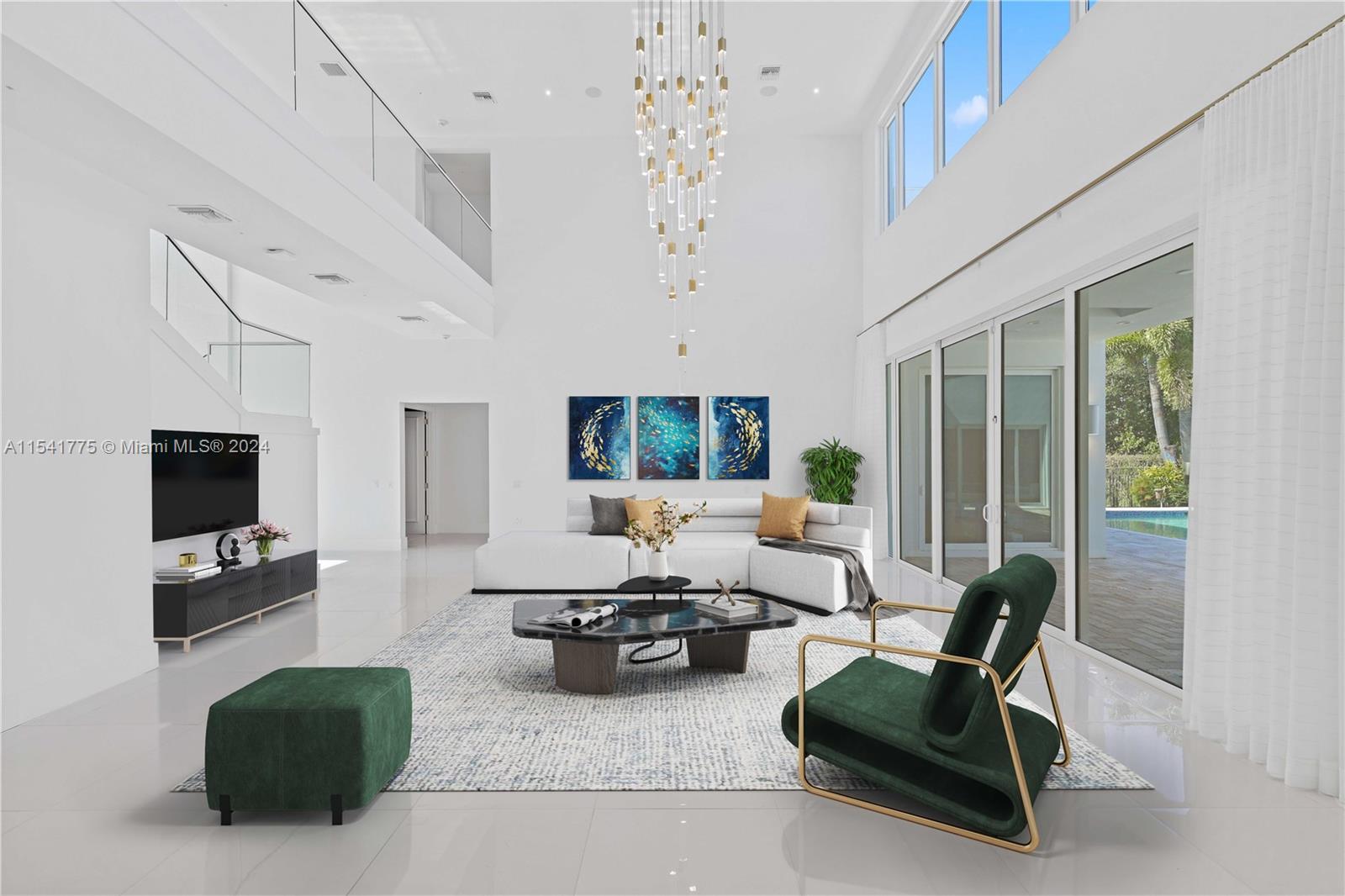 7153 Valencia Drive Boca Raton, FL 33433 - Photo 4 of 80 a living room with furniture a large window and a flat screen tv