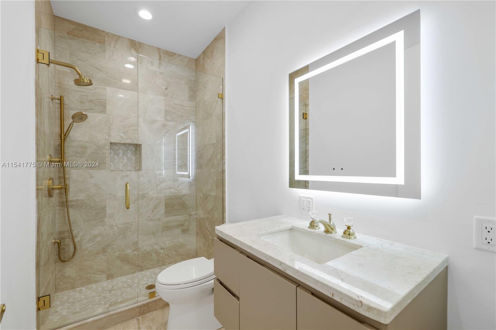 7153 Valencia Drive Boca Raton, FL 33433 - Photo 47 of 80 a bathroom with a granite countertop sink toilet and shower