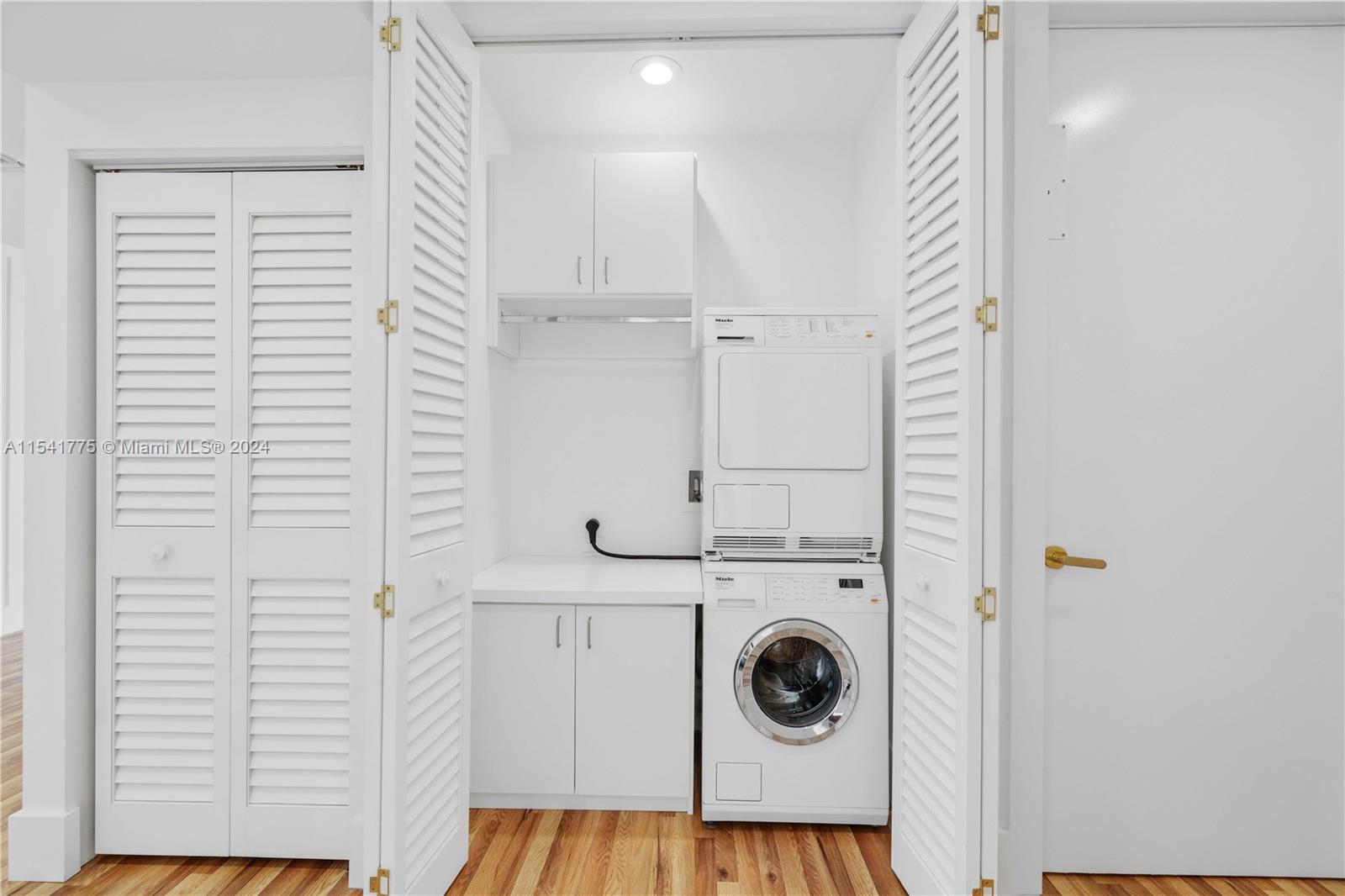 7153 Valencia Drive Boca Raton, FL 33433 - Photo 51 of 80 a view of a storage & utility room with washer and dryer