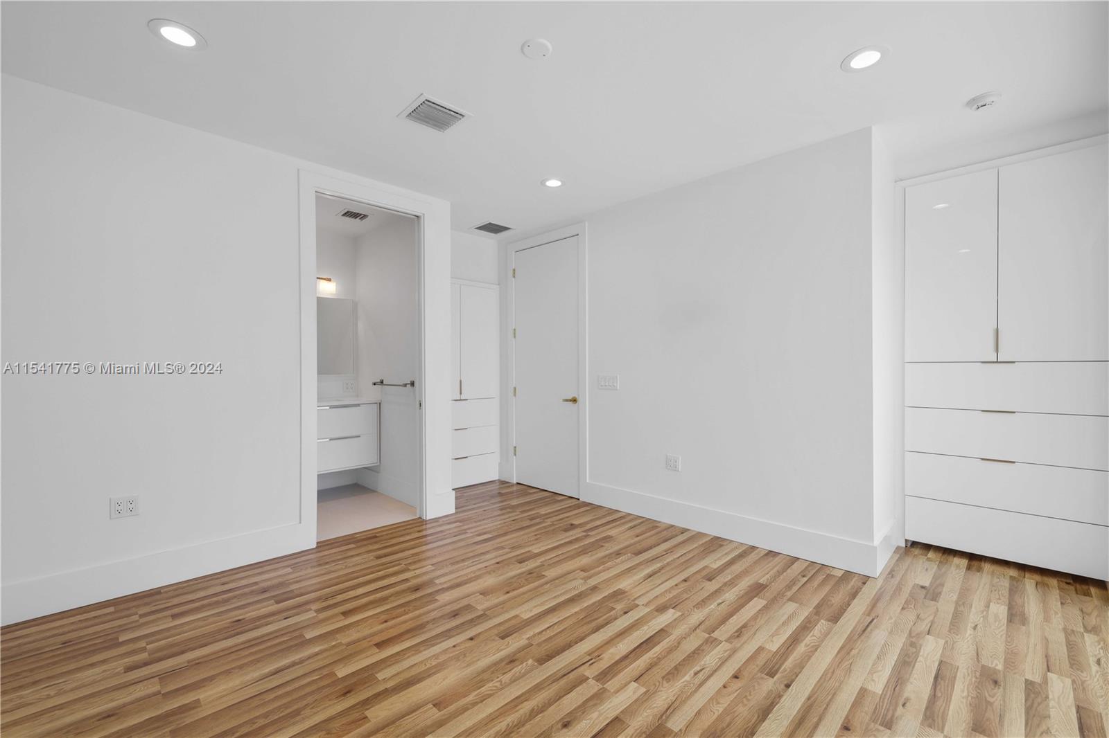 7153 Valencia Drive Boca Raton, FL 33433 - Photo 53 of 80 a view of empty room with wooden floor