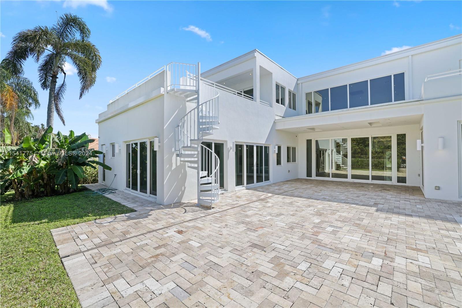 7153 Valencia Drive Boca Raton, FL 33433 - Photo 58 of 80 a view of a house with a yard and plants