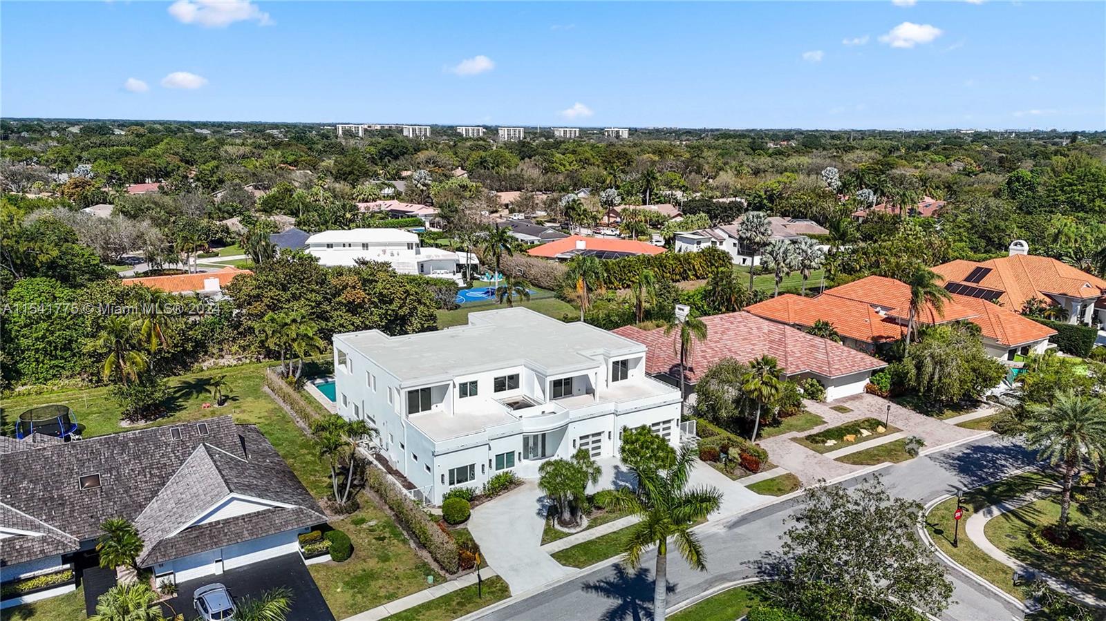 7153 Valencia Drive Boca Raton, FL 33433 - Photo 64 of 80 an aerial view of residential houses with outdoor space and trees