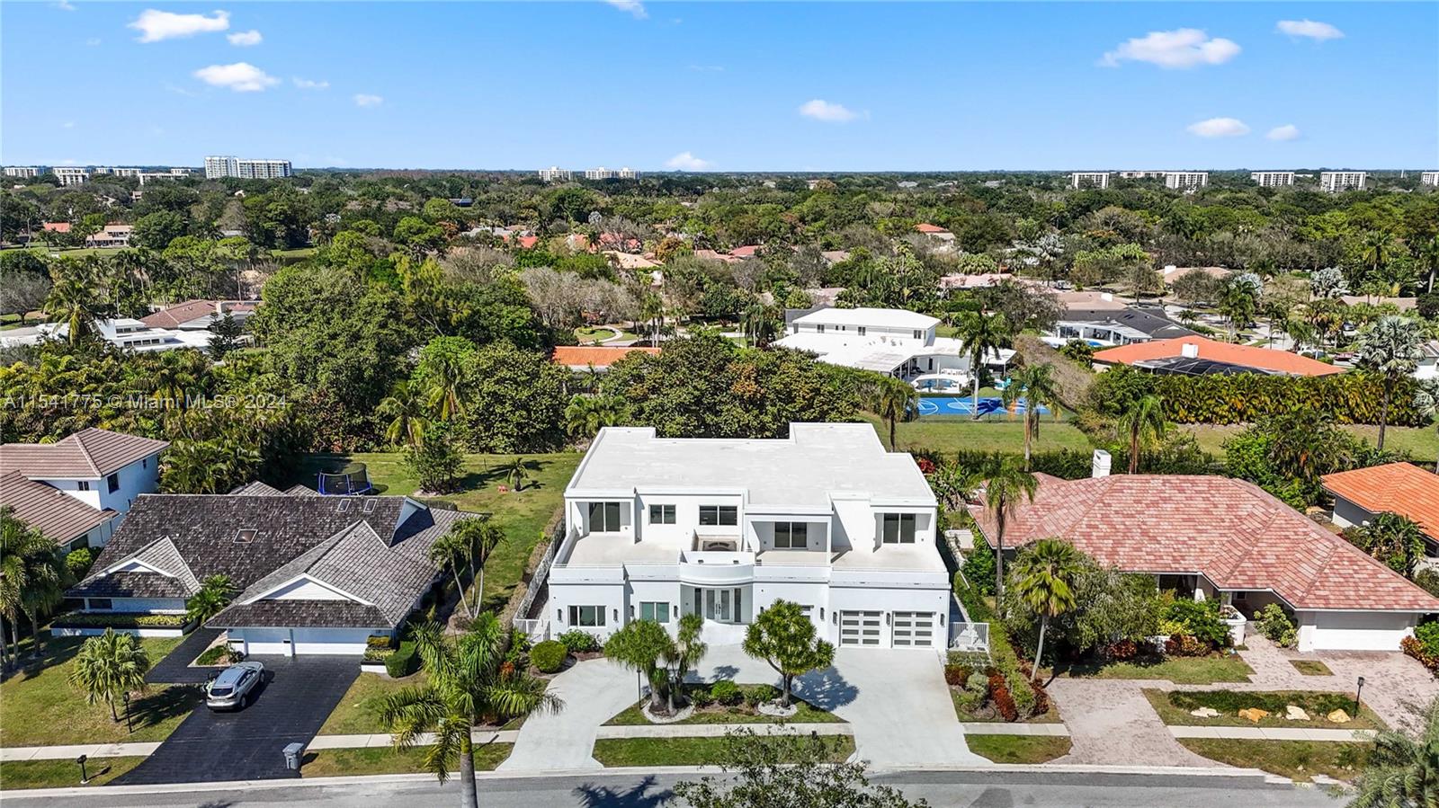 7153 Valencia Drive Boca Raton, FL 33433 - Photo 65 of 80 an aerial view of multiple houses with a yard