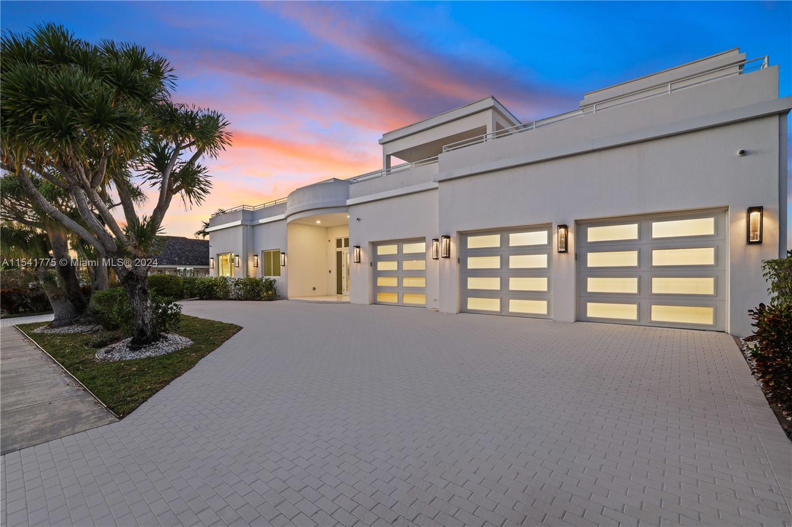 7153 Valencia Drive Boca Raton, FL 33433 - Photo 76 of 80 a view of a house with a yard and garage