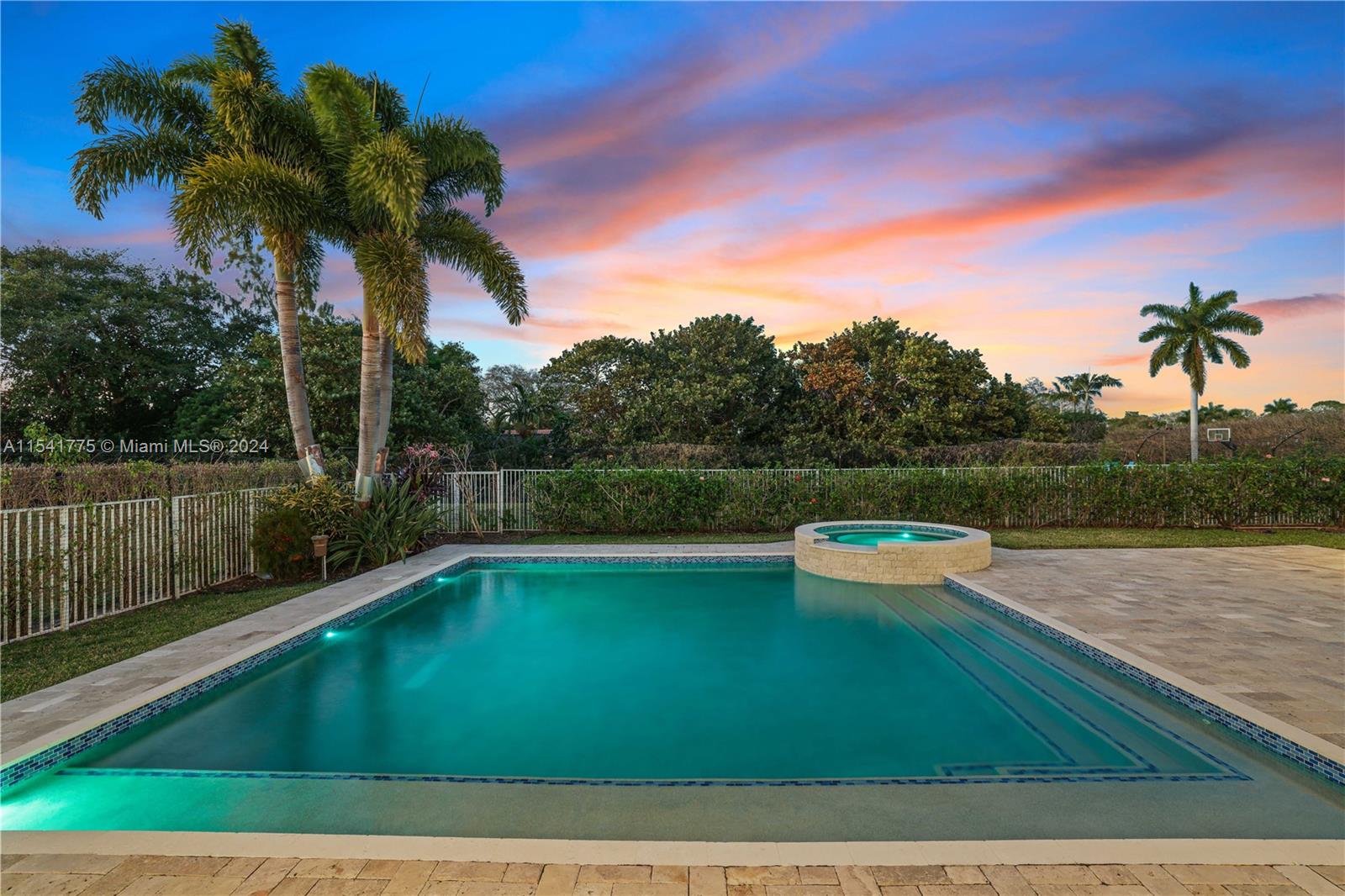 7153 Valencia Drive Boca Raton, FL 33433 - Photo 80 of 80 a view of a swimming pool with a yard