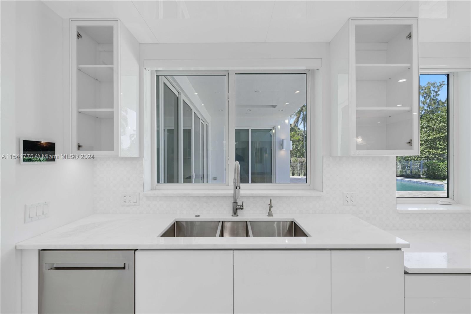 7153 Valencia Drive Boca Raton, FL 33433 - Photo 9 of 80 a bathroom with a sink and a mirror